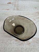 Angled top view showing folded rim and smoky color