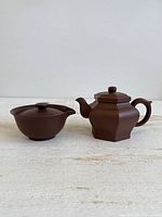 Front view of both clay teapots
