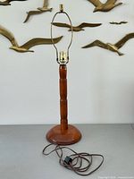 Full view of lamp base showing overall design, harp, socket, and cord