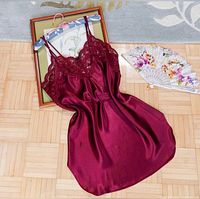Full view of burgundy satin slip dress front side on hanger