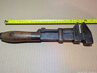 Full view of wrench with tape measure showing 12 inch length