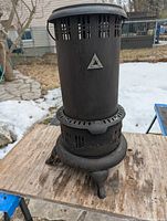 Full view of Perfection 525M kerosene heater on legs