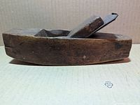 Left side view showing rounded sole, body wear, blade and wedge