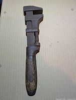 Full view wrench showing steel head, shaft, wood handle