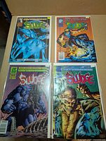 Group shot of all four Sludge comics #1, #2, #4, #5