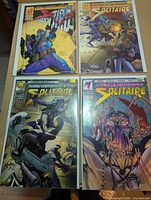Group shot of all four Solitaire comic issues in bags