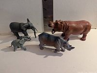 All four animal figures side by side for scale and overview