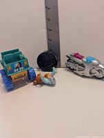 All four Wendy's kids meal toys grouped