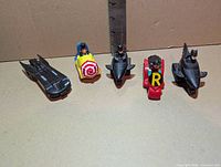 Front view of five Batman premium vehicles aligned