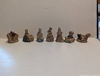 All seven Wade Nursery Rhyme figurines lined up
