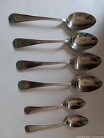 Six spoons laid out showing sizes