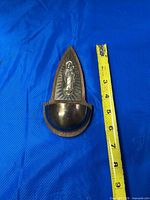 Front view showing Madonna figure and basin