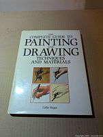 Front cover showing title, author and illustrative panels