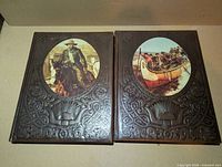 Front covers of both volumes showing embossed design and cover art