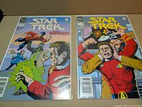 Front view of both Star Trek issues 8 and 9 in sleeves