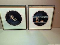 both framed prints side by side