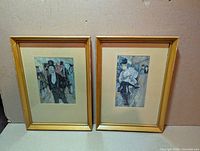 Both framed prints side by side, showing frames and mats