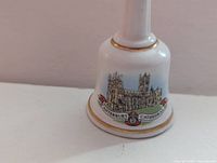 Front view Canterbury Cathedral bell showing graphic and gold trim