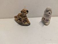 Front view of both Wade dog figurines