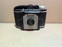 Front view of Beacon Two-Twenty-Five camera showing branding and lens