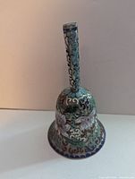 Full view of cloisonné hand bell showing enamel design