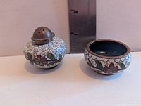 Pepper shaker and salt bowl front view next to ruler