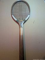 Full view of wooden Court tennis racket front