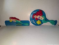 Comb and round hair brush front view