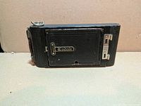 Camera folded, rear view showing Kodak nameplate and leather covering