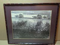 framed monochrome lithograph with bamboo-style frame and purple mat