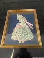 Full view of framed ribbon art doll shadow box