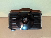 Top view showing adjustable lens housing and shutter lever