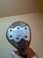 Close-up of sole plate showing Truline logo, 1-wood designation and model number 5460