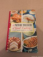 Front cover of the cookbook showing title, binding, and food images