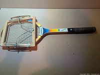 Full view racket with attached wooden press