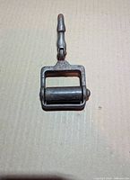 Front view showing roller frame and hook