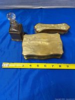 All three vanity pieces with measuring tape for scale