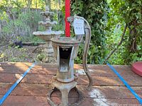 Full view of cast-iron hand pump on deck