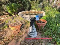 bird bath and two pots on patio