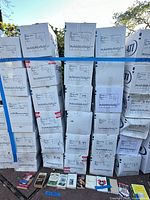 Front view of stacked white bankers boxes strapped together