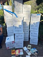 Stack of labeled cardboard boxes filled with books