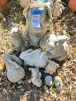 Group shot of all concrete rabbit statues on ground