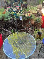 Table and wind spinner in garden setting