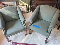 Front view of both matching upholstered armchairs