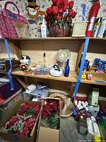 Full view of shelving and boxed artificial flowers