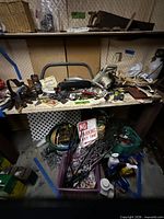 Workbench with power tool, hand tools, hardware, sign, storage totes, watering can