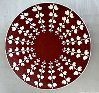 Top view showing red interior and white leaf pattern