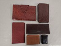 All six items laid out flat showing fronts and relative sizes