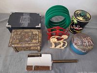 All items laid out including tins, napkin rings, holders, mirror and decorative box