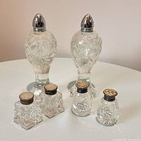 Group view of all six crystal shakers showing relative sizes and caps